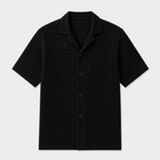 Black short-sleeve shirt on a light gray background