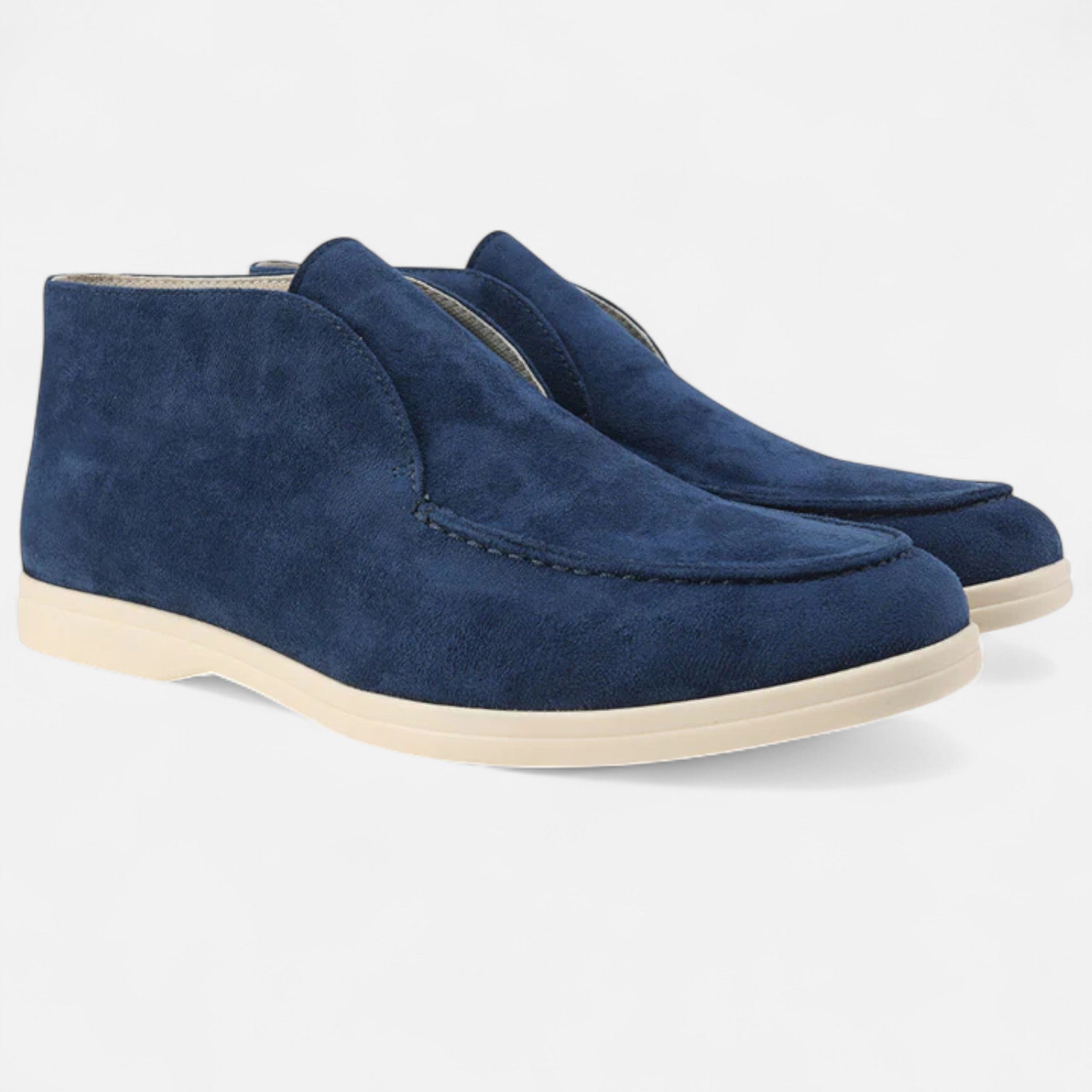 Pair of blue suede shoes on a white background