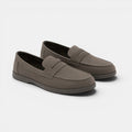 Pair of brown loafers on a white background