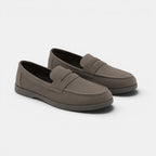 Pair of brown loafers on a white background