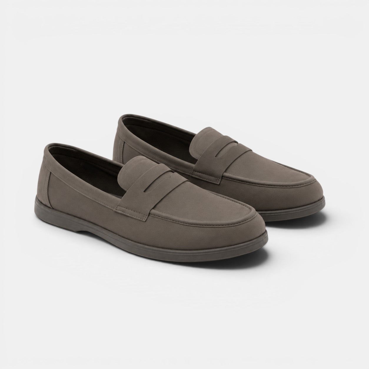 Pair of brown loafers on a white background
