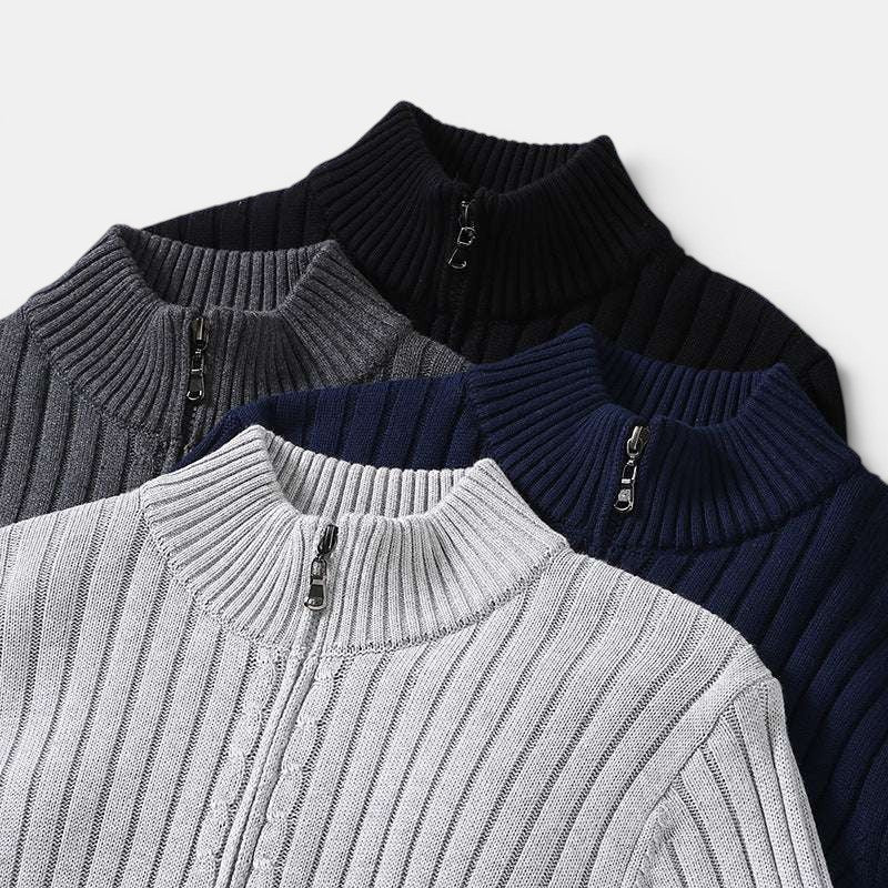 Four quarter-zip sweaters in gray, black, blue, and white on a light gray background.