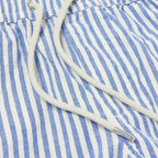 Close-up of blue and white striped fabric with a drawstring