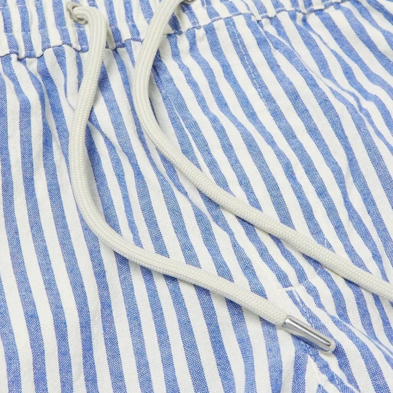 Close-up of blue and white striped fabric with a drawstring