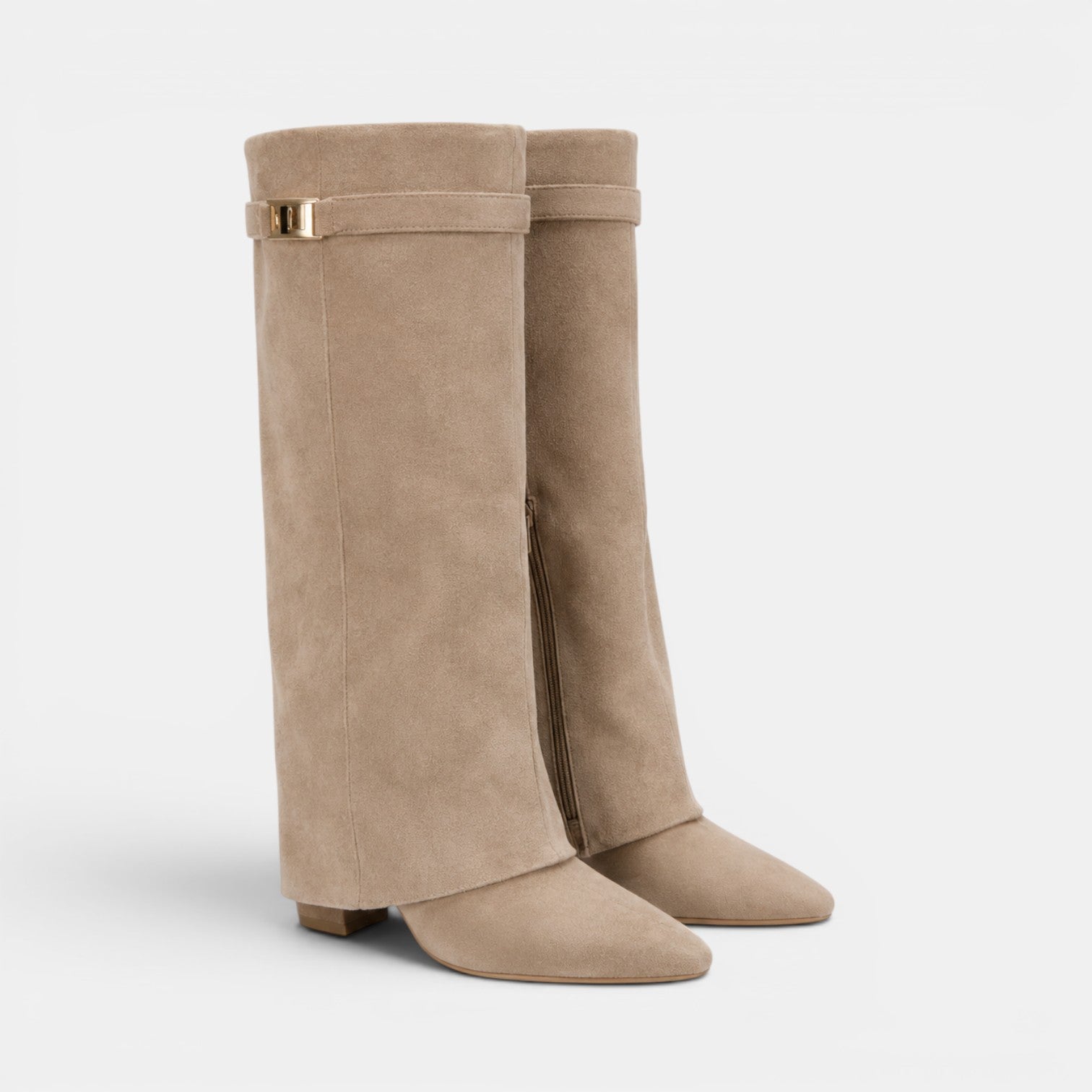 Pair of beige knee-high boots with gold accents on a light gray background