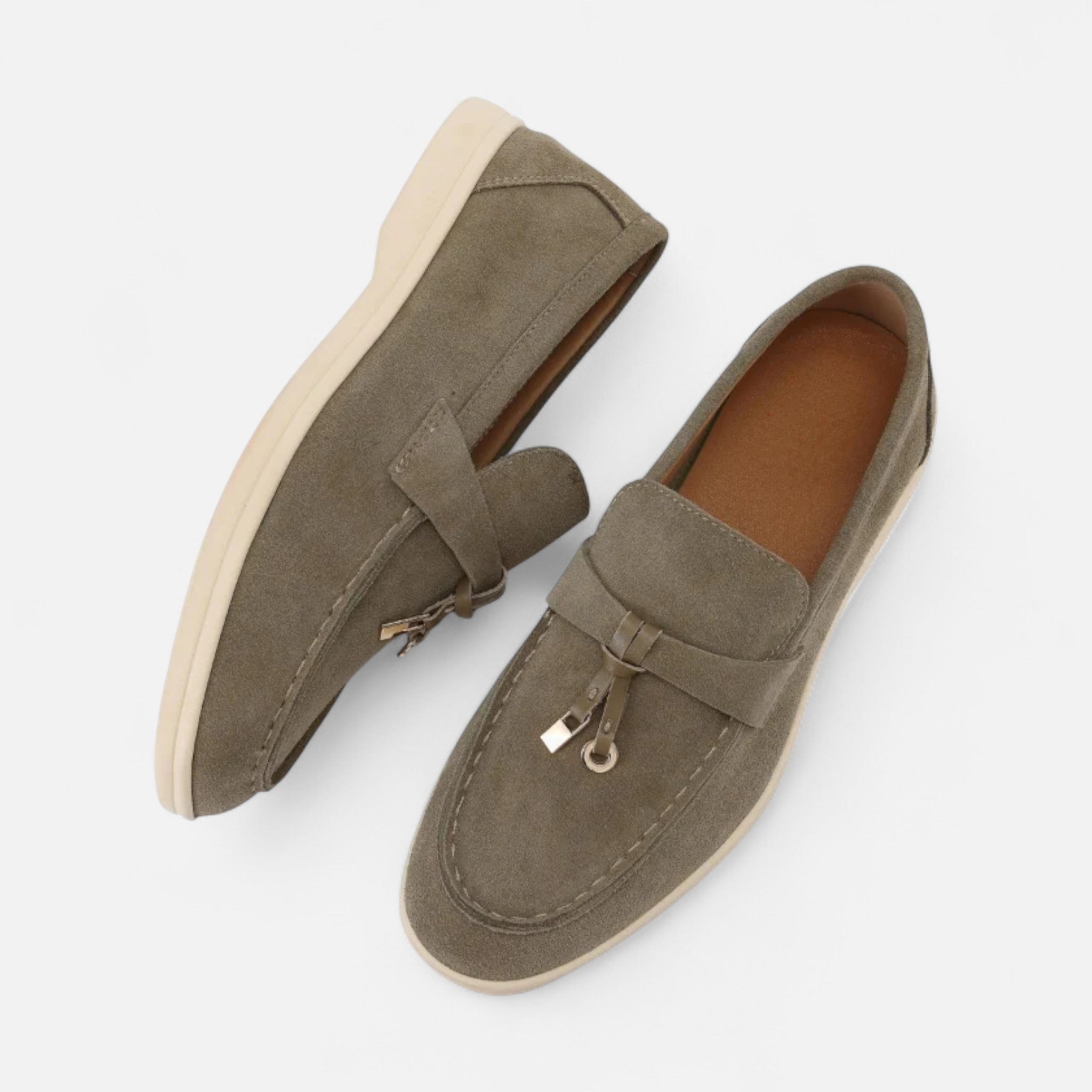 Pair of brown loafers on a light gray background