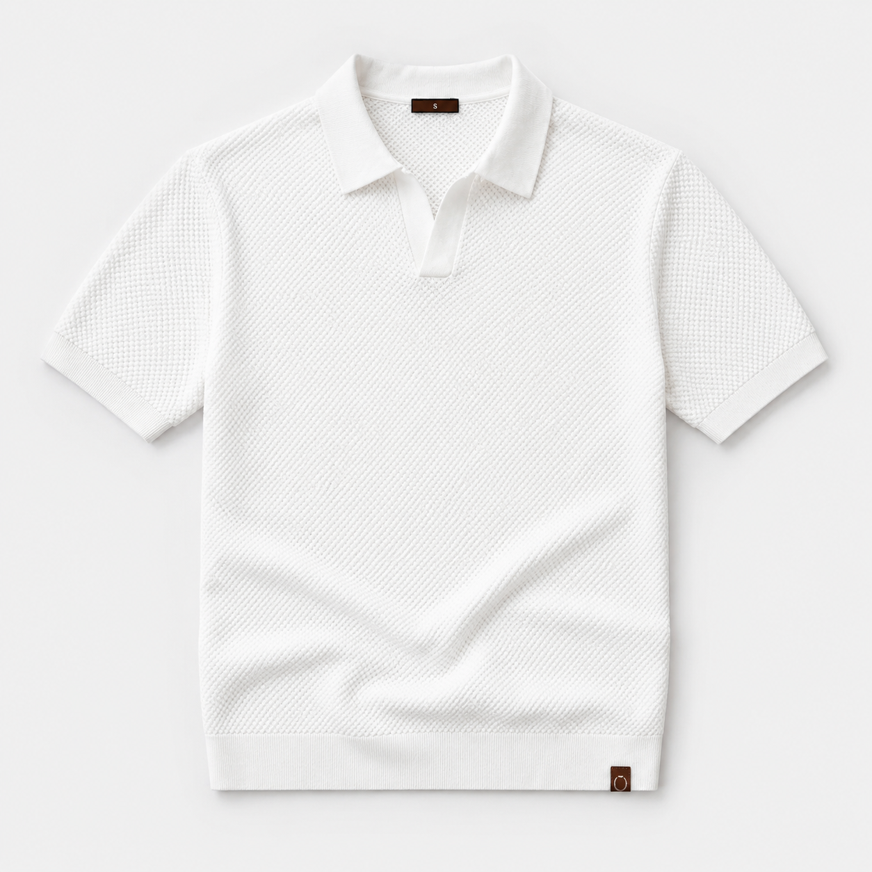 White textured polo shirt on a light gray background