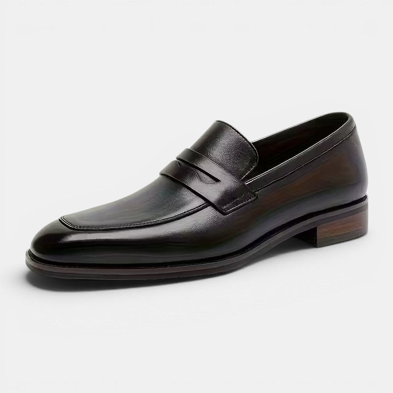 Black leather loafer shoe on a white background