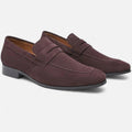 Pair of maroon loafers on a white background