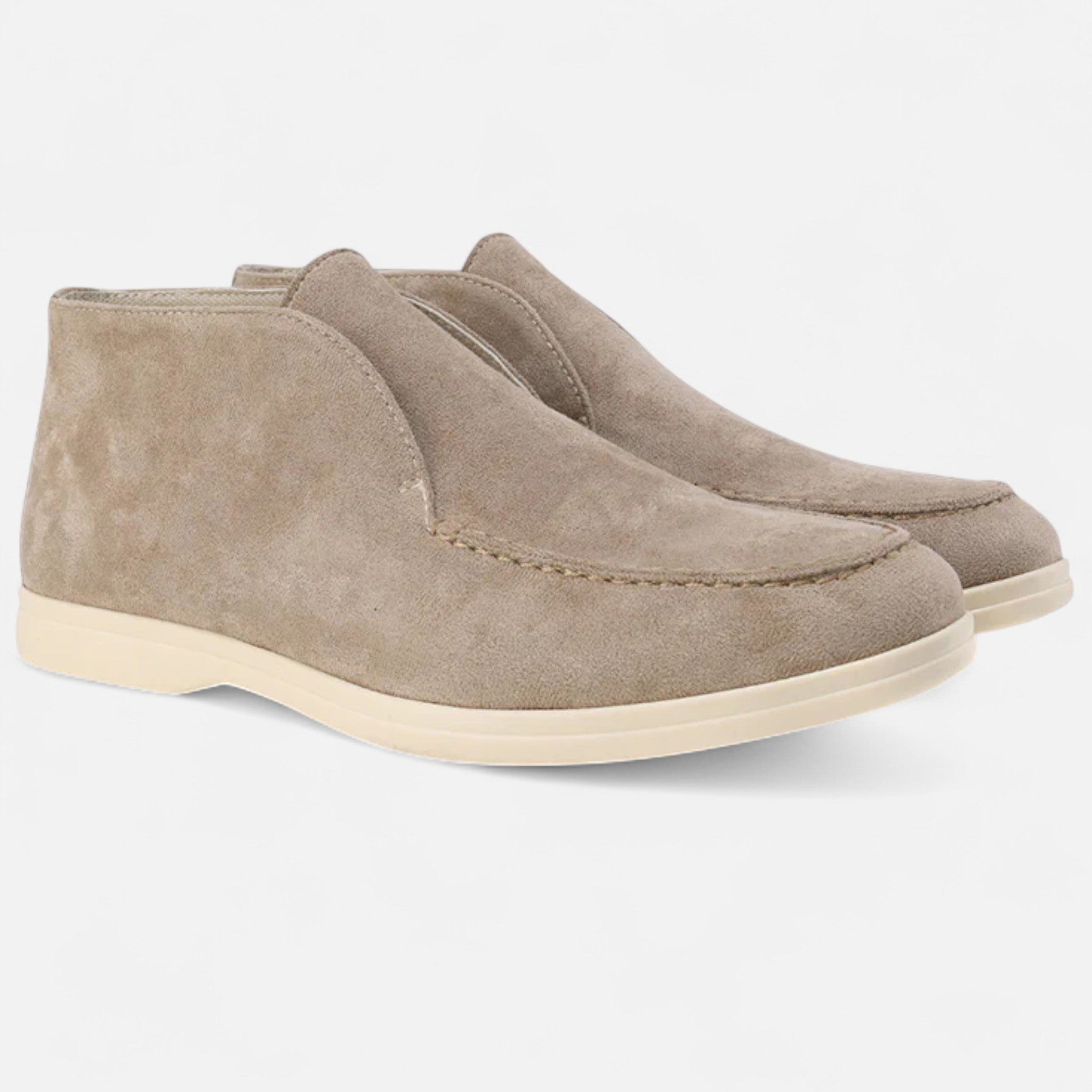 Pair of brown suede shoes on a white background