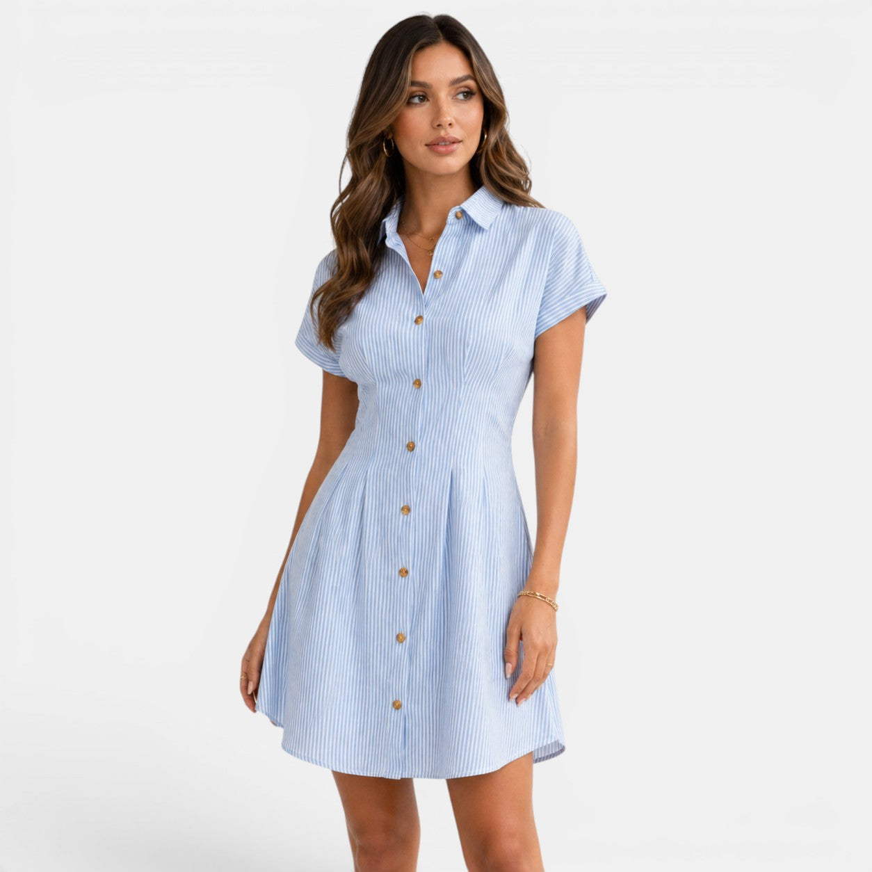 Woman wearing a blue and white striped dress on a white background