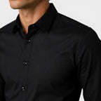 Close-up of a black dress shirt on a neutral background