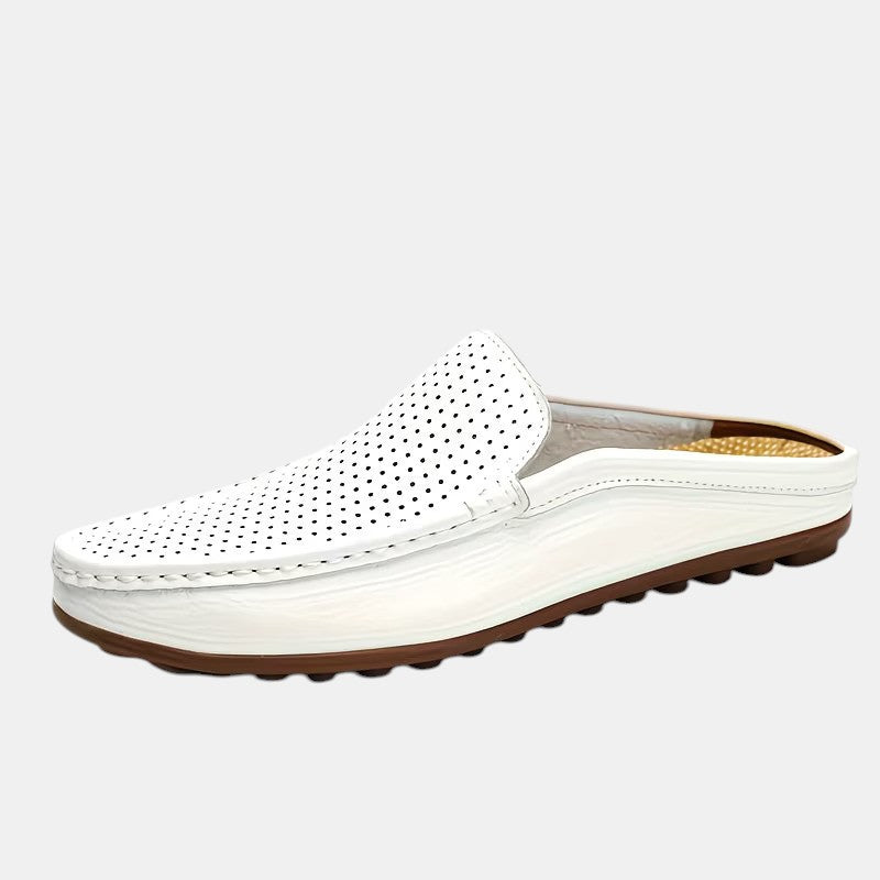 White loafer shoe with brown sole on a light gray background