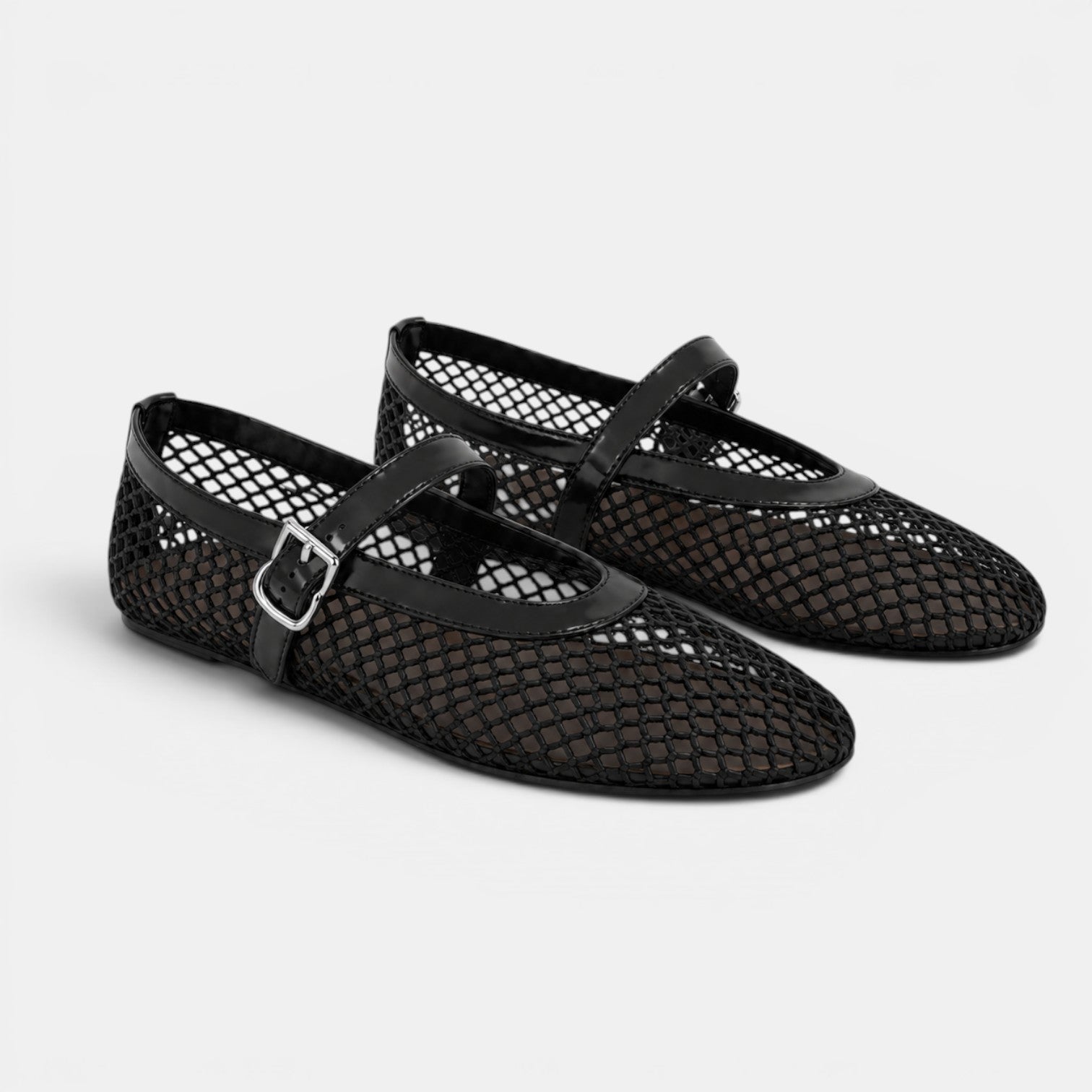 Pair of black mesh shoes with a strap on a light gray background