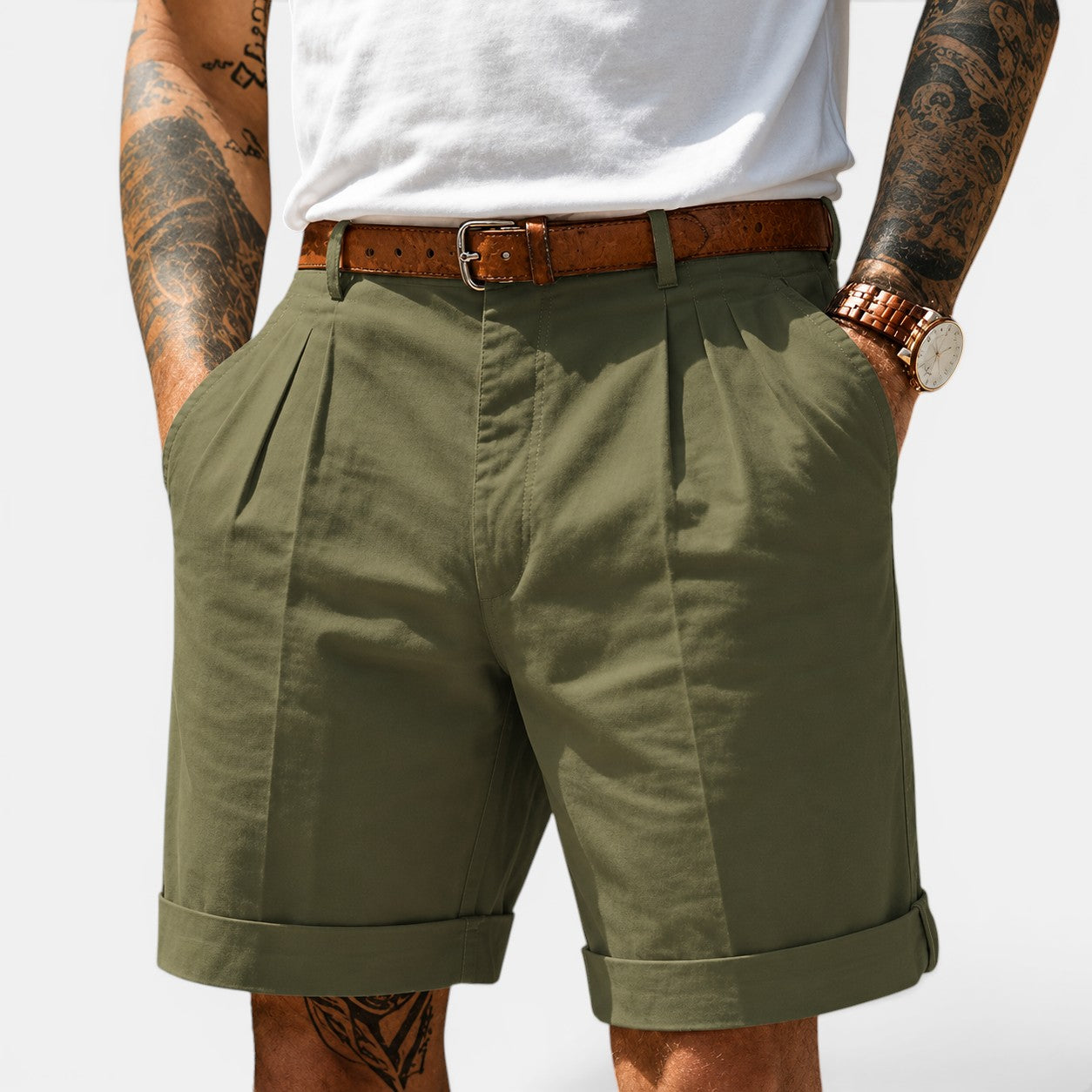 Person wearing green shorts with a white background