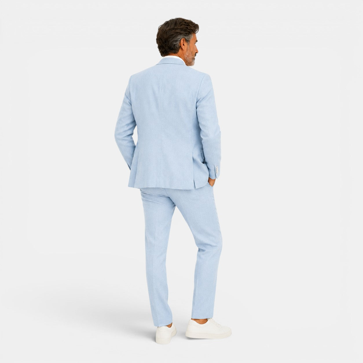 Man wearing a light blue suit on a white background