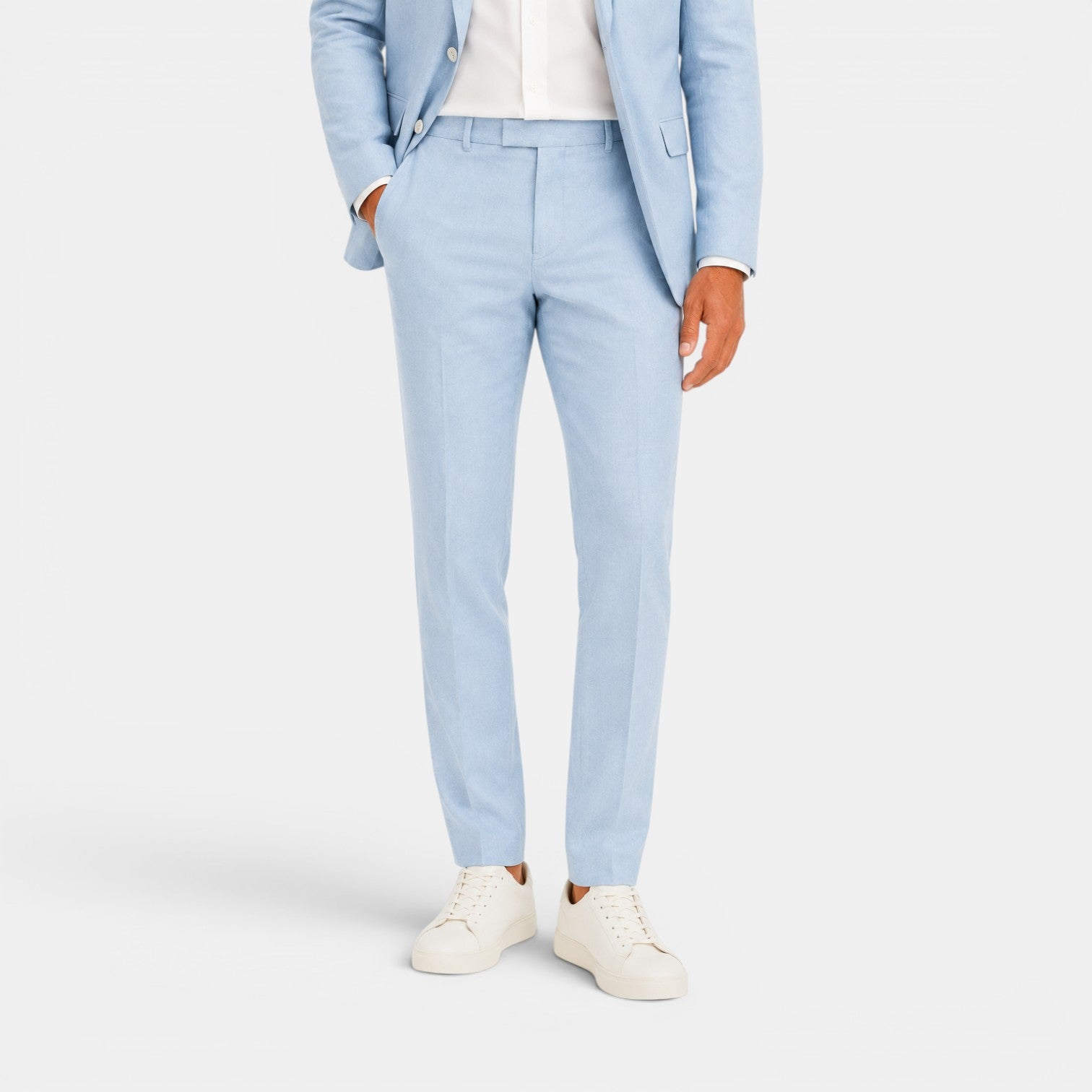 Light blue suit with white shirt and sneakers on a white background