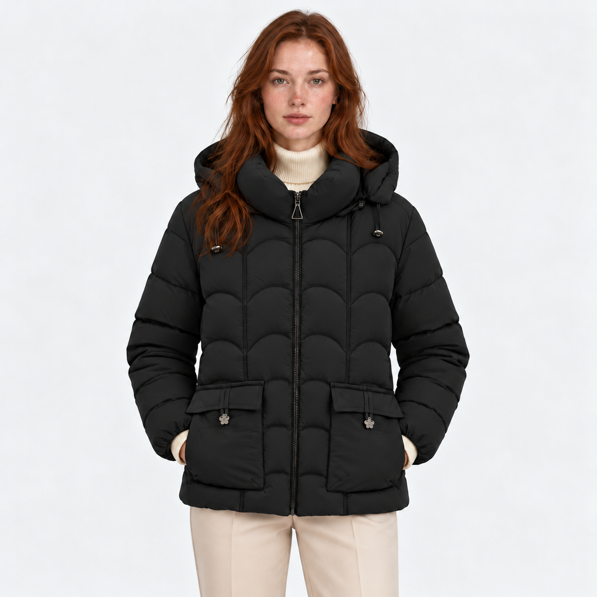 Women's black quilted puffer jacket with hood, front zipper, and flap pockets