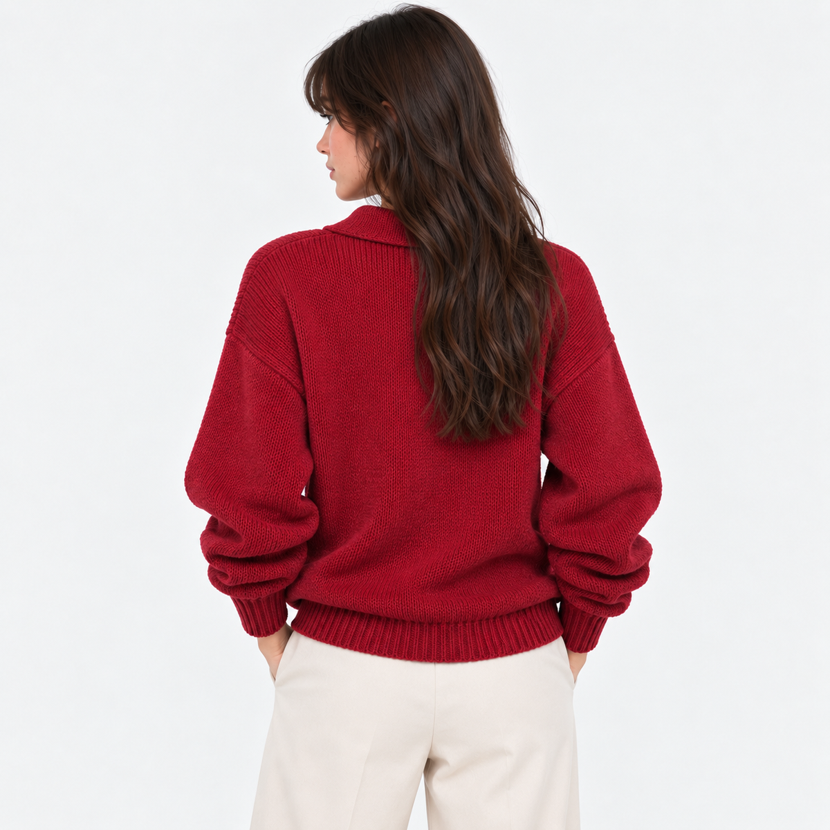 Back view of a woman wearing a red long sleeve knit polo sweater