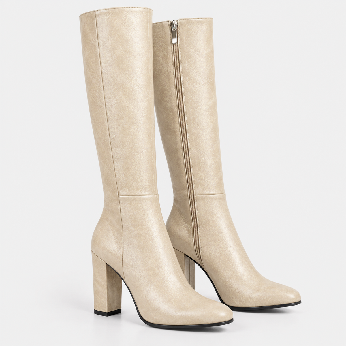 Women's cream knee-high boots with side zipper, pointed toes, and block heels