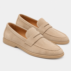 Men's beige suede loafers with penny strap detail and flat soles