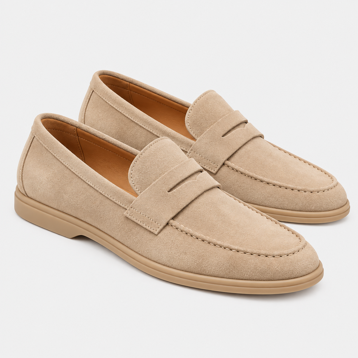 Men's beige suede loafers with penny strap detail and flat soles