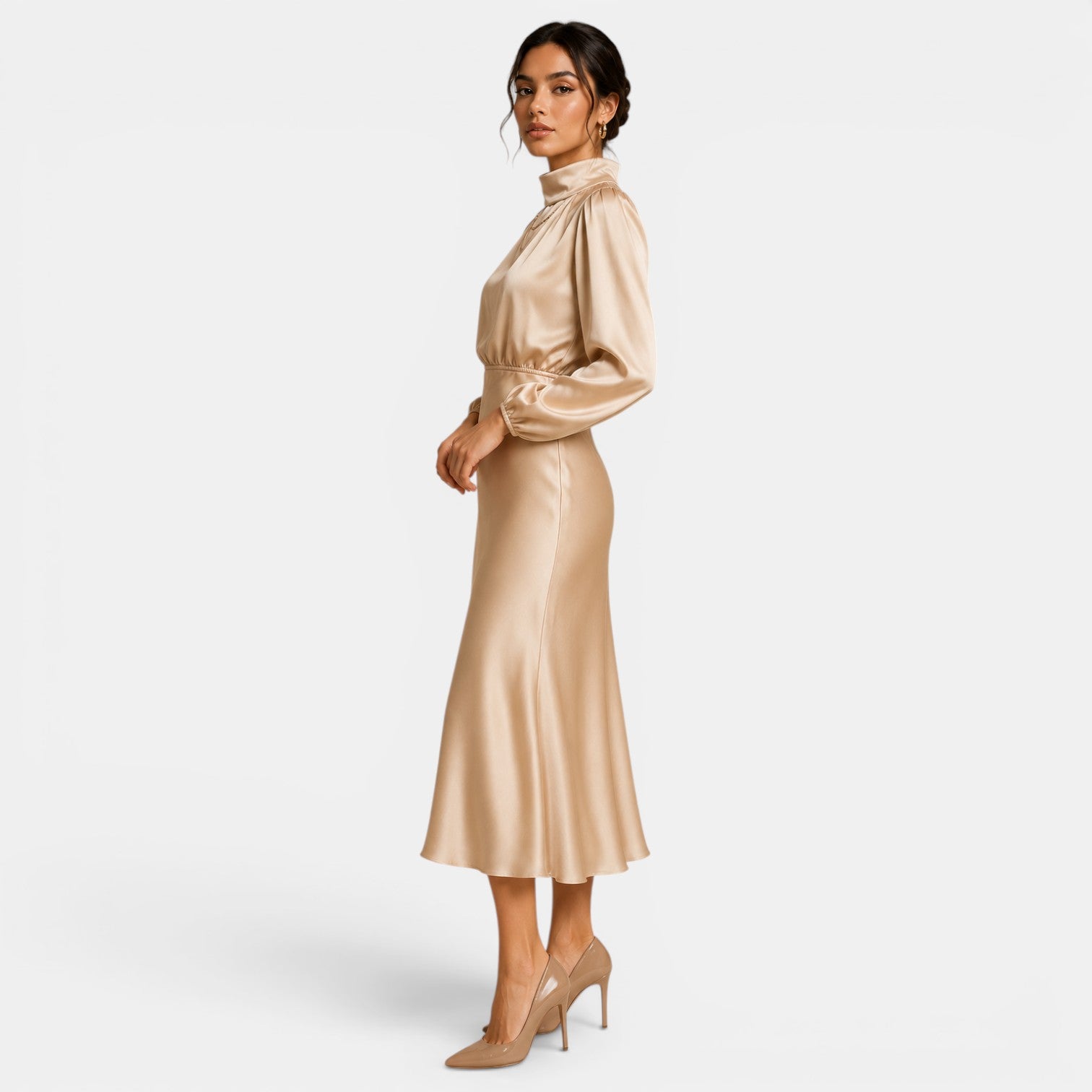 Woman wearing a gold satin dress on a white background