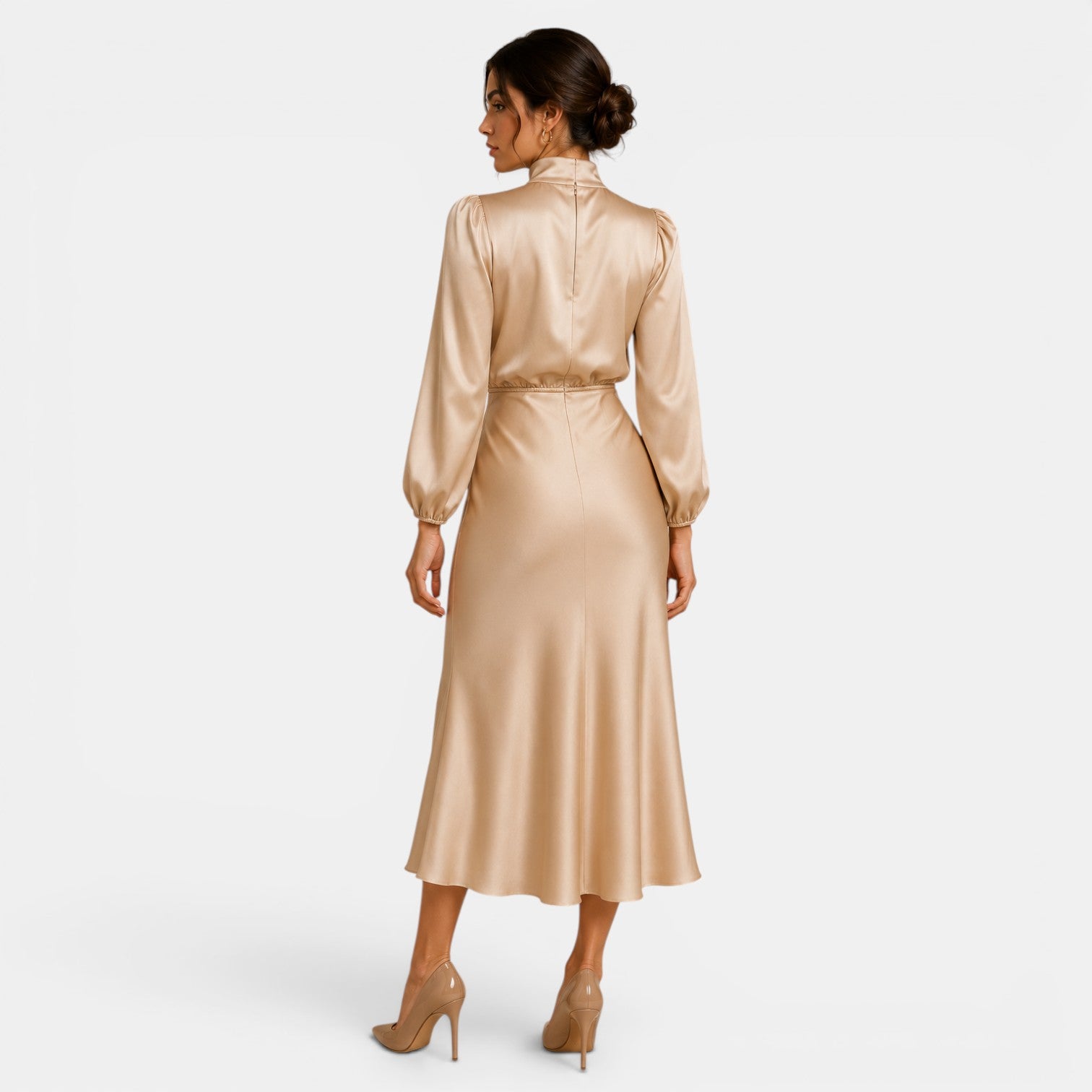 Woman wearing a gold satin dress on a white background