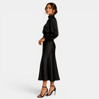 Woman wearing a black turtleneck dress on a white background