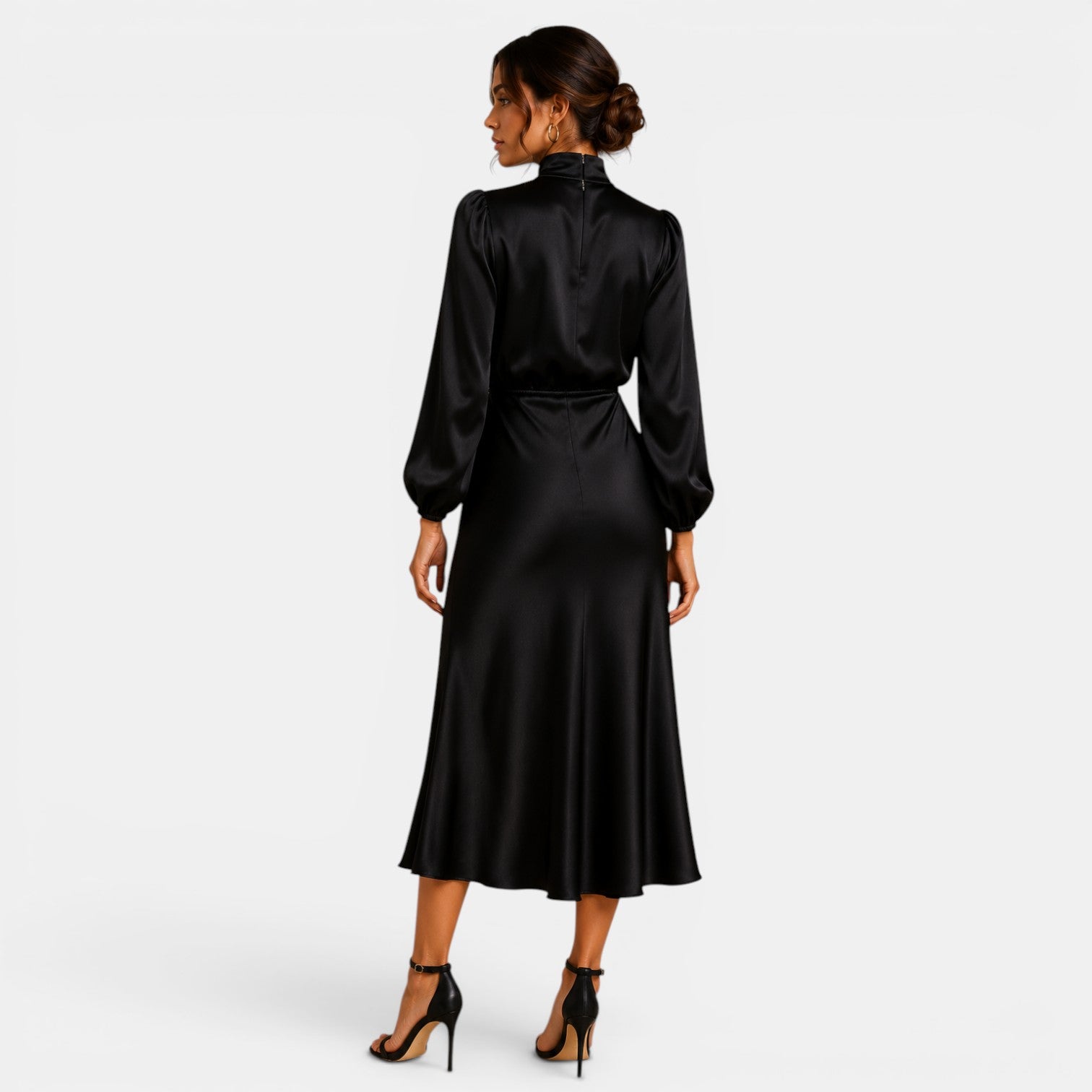 Woman wearing a black satin dress on a white background