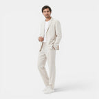 Man wearing a light-colored suit on a white background