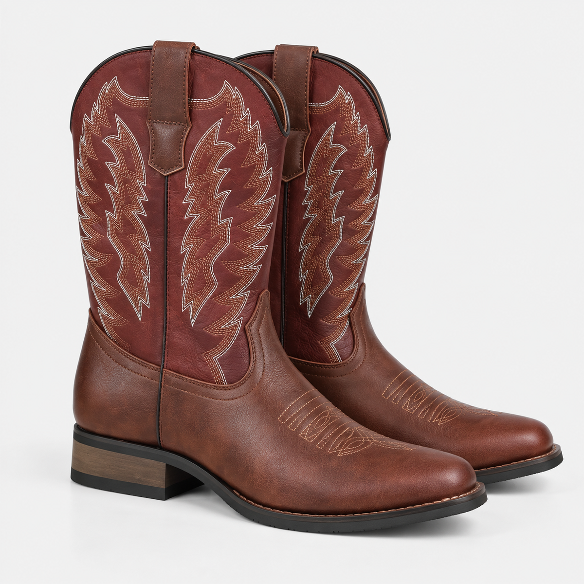 Women's dark brown leather cowboy boots with decorative western stitching and stacked heels