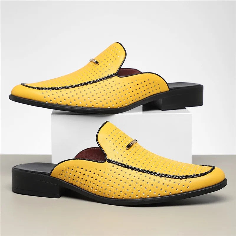 Yellow loafers with black accents on a white background