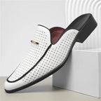 White loafer with black accents on a white background