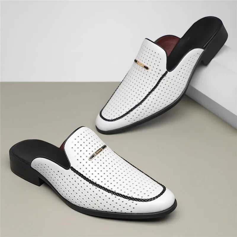 White loafers with black soles on a light gray background