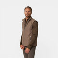 Man wearing a brown jacket on a white background