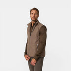 Man wearing a brown jacket on a white background