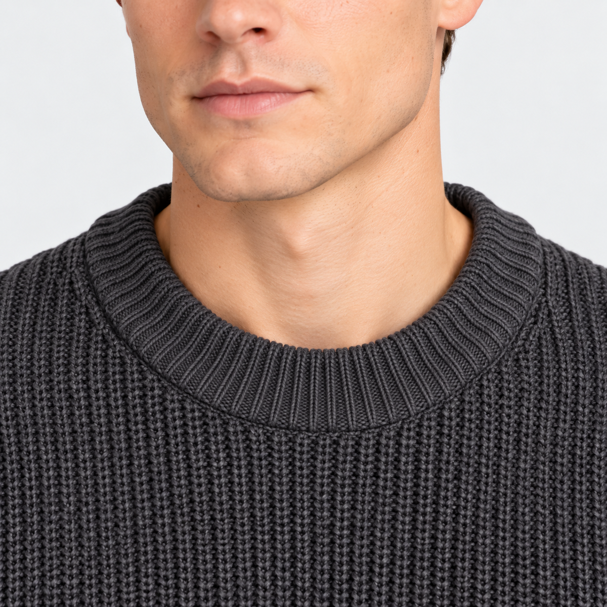 Close-up of men's charcoal gray ribbed knit sweater with crew neckline