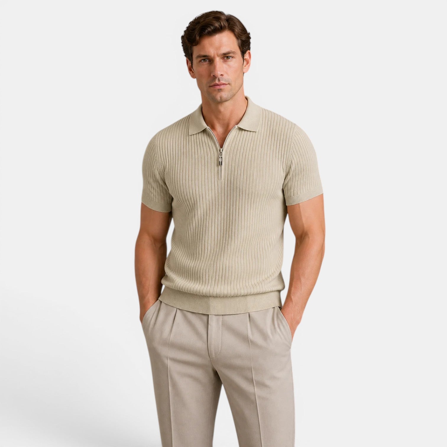 Man wearing a beige ribbed knit polo shirt with matching tailored trousers against a light gray background.