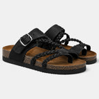 Pair of black braided strap sandals with adjustable buckle closures and cork-style footbeds.