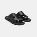Pair of black sandals on a light gray background