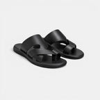 Pair of black sandals on a light gray background