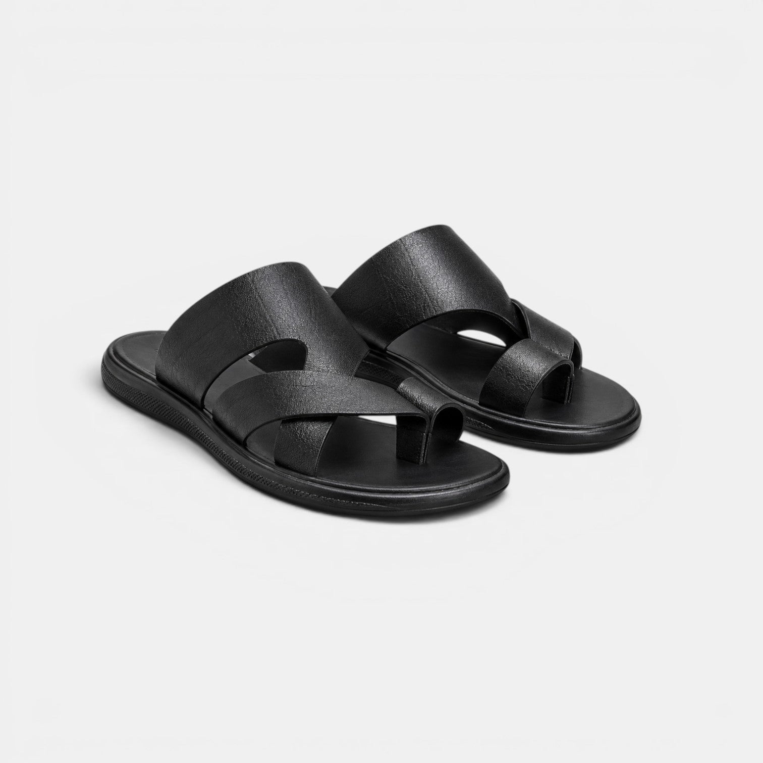 Pair of black sandals on a light gray background