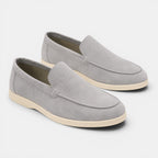 Pair of gray loafers on a white background