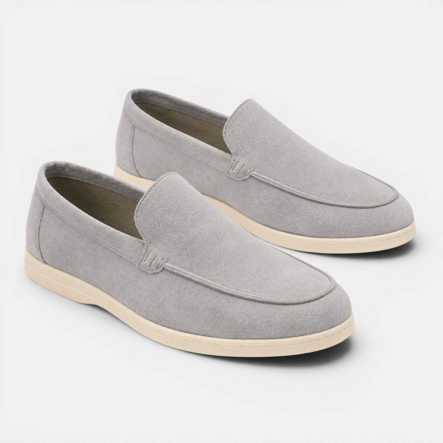 Pair of gray loafers on a white background