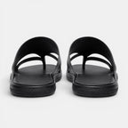 Pair of black sandals on a white background