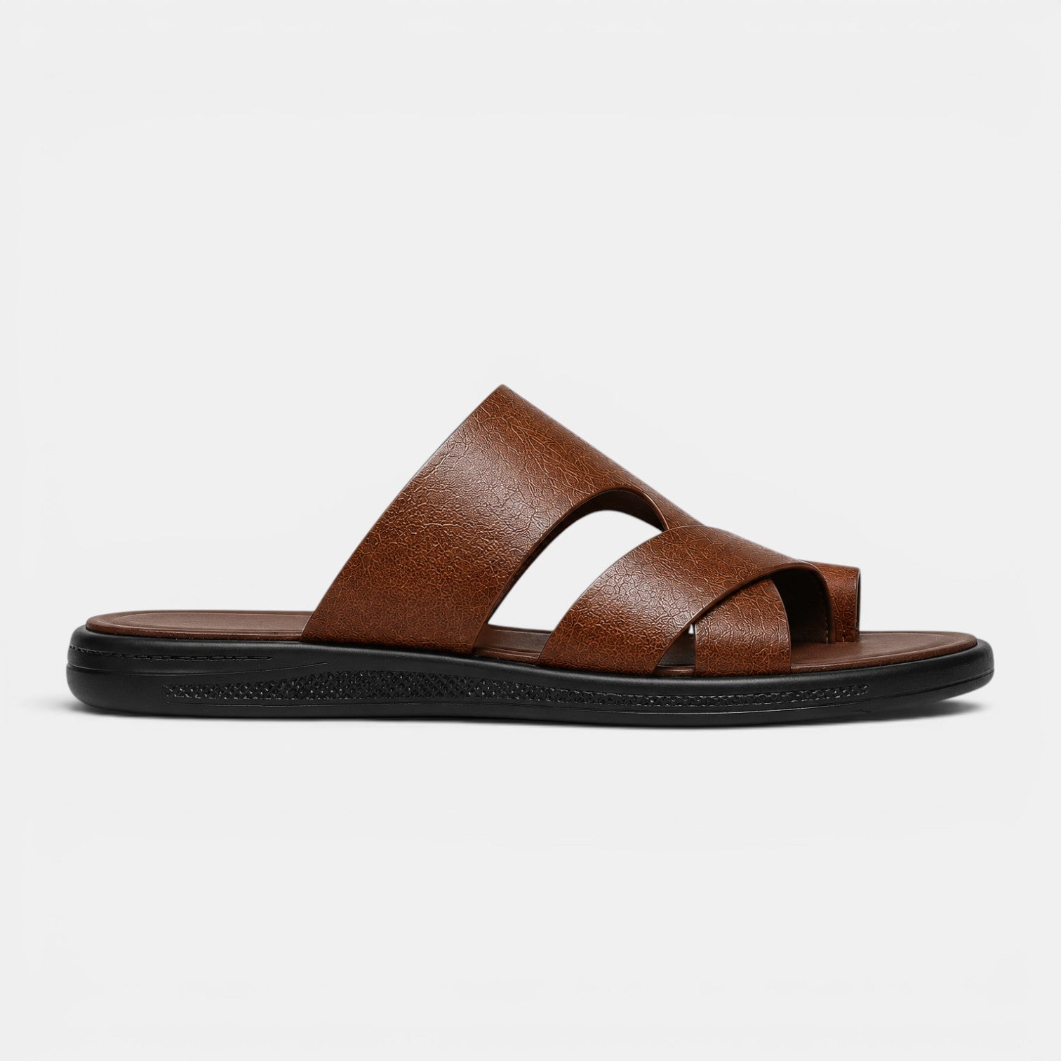 Brown sandal with a black sole on a light gray background