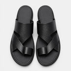 Pair of black sandals on a light gray background