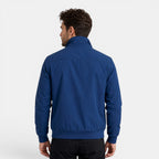 Man wearing a blue jacket on a white background