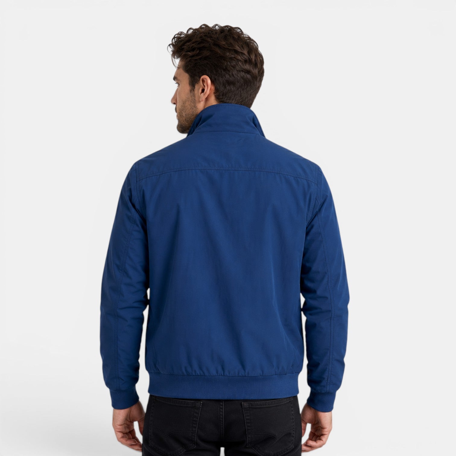 Man wearing a blue jacket on a white background